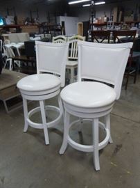 PAIR OF SWIVELING WHITE COUNTER HEIGHT CHAIRS