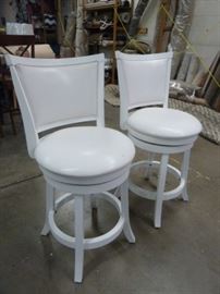 PAIR OF SWIVELING WHITE COUNTER HEIGHT CHAIRS