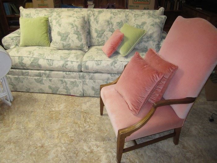 Green print sofa, pink side chair