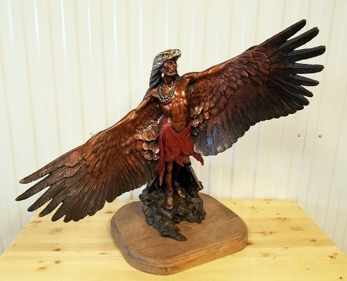 1986 painted bronze sculpture of a Native American dancing with arms transformed into eagles wings, #1/50, by Dan Garrett (Casper, Wyoming, 1948-), 24" x 31" x 13"