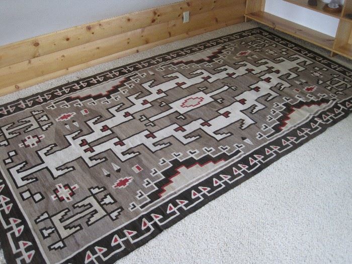 Large, finely hand woven Navajo Crystal rug, probably from the Four Corners area of New Mexico, well designed, measuring 6' X 10 1/2'. Please review detailed photos on the auction site carefully for condition.