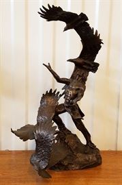 1991 mixed media metal sculpture of a Native American praying while surrounded by flying eagles, entitled "Soaring Spirits" by Buck McCain (Arizona, 1943-), produced by The Franklin Mint, 21" x 12" x 9"