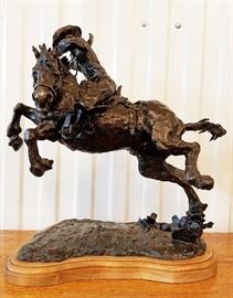 Bronze sculpture of a cowboy on a leaping horse, #11/12, entitled "John T. III", by James Collender (Wyoming, 1935-1988), 20" x 18" x 14"