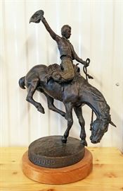 1988 bronze sculpture of a cowboy on a bucking horse, #4/100, entitled "Wyoming Centennial Roundup 1880-1980", by Skip Glomb (Wyoming 1935-1988), 23" x 19" x 11"