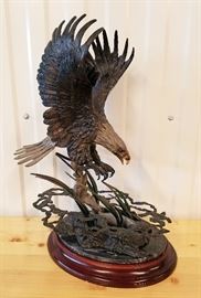 1990 bronze sculpture of an eagle landing on a pond to catch a fish, entitled "Pride and Passion", by Dennis Jones (Arizona 1943-), 20" x 14" x 9"