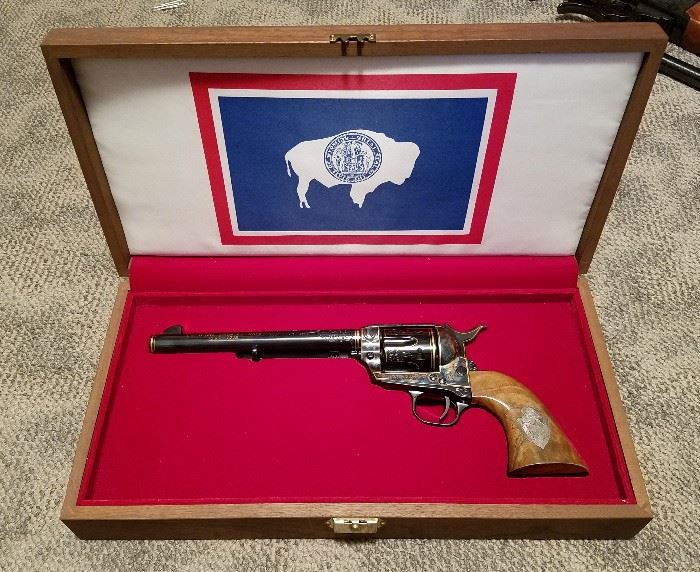 One of a kind commemorative second generation Colt Single Action Army revolver with Certificate of Authenticity from the 1978 Cheyenne Frontier Days Committee, 45 caliber, 7 1/2" barrel, royal blue finish, barrel and frame engraved with rodeo scenes, walnut grips inlaid with the official Cheyenne Frontier Days emblem, in original walnut presentation box, Serial #CFD1978