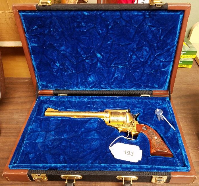 1990 Wyoming Statehood Centennial special limited edition #125/125 Ruger New Model Super Blackhawk revolver, 44 Magnum, gold plated and engraved with mining and buffalo hunting scenes by A&A Engraving, Rapid City, South Dakota, walnut grips laser engraved with a portrait of John Colter and a gun fight, Serial #88-80636. In presentation case. Also comes with its original factory case with paperwork.