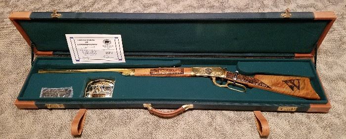 Special limited edition Winchester Model 94AE rifle, complete boxed set #90/100, including COA and belt buckle. Rifle is lever action, 38-55 Win caliber. angle eject, gold plated receiver, barrel, and lever, receiver engraved with Wyoming themes by A&A Engraving, Rapid City, South Dakota, laser engraved walnut stock and fore stock, Serial #6351312