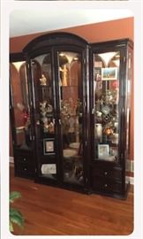 mahogany wall unit with decorative glass panels. measuring 80 tall 78 wide 20 deep of beauty and greatness. Featuring 4 drawers, inside lighting, and several shelfs for your collections.