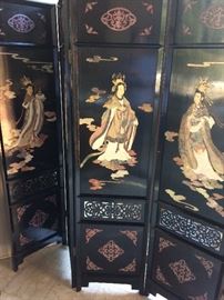 One of two black lacquer Asian folding screens with hard stone detail