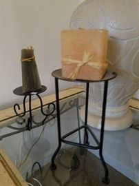 cute candles on black metal candleholders