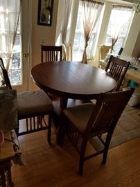 beautiful round pub style table with inlaid wood and 6 high padded chairs. Only 4 chairs pictured due to space.