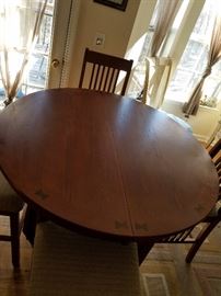 Beautiful round solid high, inlaid wood table with 6 high chairs.