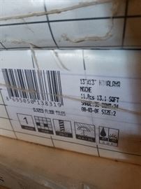 Several boxes of 3 kinds of floor tiles.  