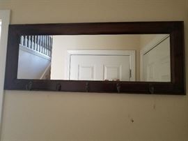 Wall mirror with hooks