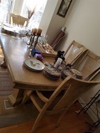 Large Dining room table with 6 chairs and leaf. 2 of the chairs are captain's chairs, matching hutch and three drawer sideboard available.