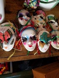 Several plaster painted masks.