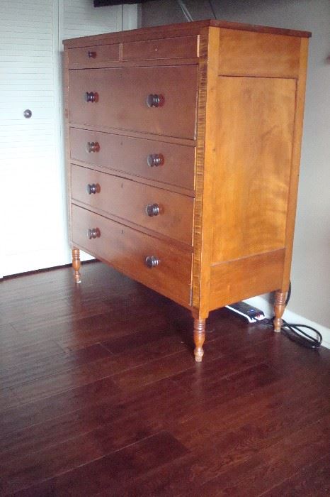 Side view of Sheraton chest of drawers.