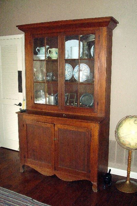 1875 period pine kitchen cupboard with 12 glass panes and two doors below.