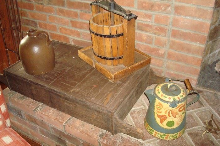 Antique toleware coffee pot, old sled, apple press and jug.