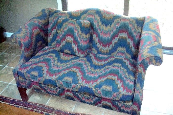 Vintage custom upholstered Chippendale style love seat.