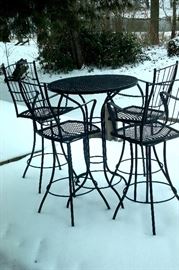 Wrought iron patio high table & four chairs.