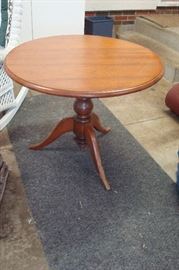 1850's round walnut pedestal table with damage to feet.