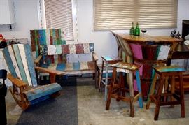 Great Tiki style bar. Comes with  Adoirondack rocker, straight bench, cocktail table, three bar stools and hanging wall section.  nice items for man cave, covered patio, family room or whatever....