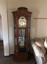 Howard Miller grandfather clock model 610-493 with curio and light