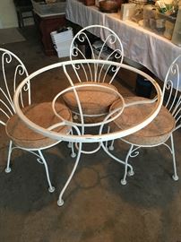 Bistro table and chairs; 3 chairs with upholstered cushions; glass top is missing.