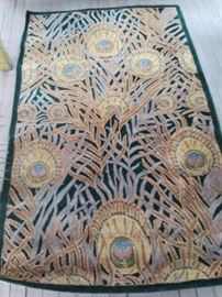A lovely Barcelona Collection 100% wool rug, hand tufted with very unique patterns, reminiscent of peacock feathers mixed with ferns. Green primary color. Corners good, some wear on one edge.