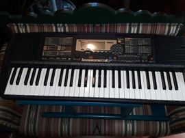 Yamaha PSR-225 electronic keyboard. Works very well. Portable, can run on batteries.