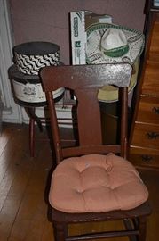 Antique Mission Style Rocket with Vintage Hat Boxes and Hats in the Background