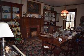 View of Dining Room with Dining Table with 4-6 leaves and set of Matching Dining Chairs plus Antique Furniture, Glassware, Silver and Much Much More!!!