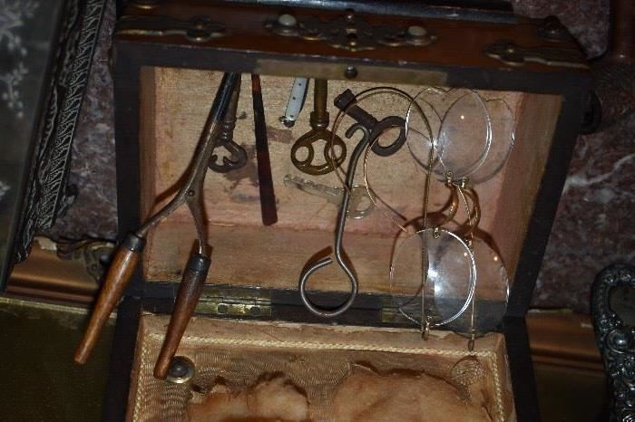 Antique Box filled with Antique Eyeglasses, Skeleton Keys, Hair Curler, Pin Knife, Button Hook