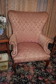 Antique Wing Back Style Chair with beautifully carved legs!