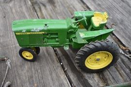Vintage Metal John Deere Tractor with Attachments Also, pictured later very rare Ertl Caterpillar and Road Grader in original boxes