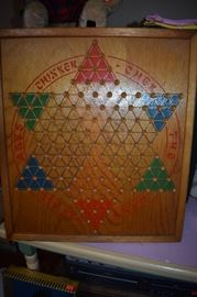 Original 1937 "Chinkerchek" Chinese Checkers Board in Immaculate Condition comes Complete with Original Packaging which still has an Original Wooden Longbox with Marbles inside. Looks to have never been removed except for the tear in the Paper Packaging ( as shown in photo )
