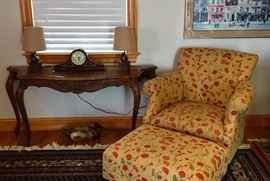 Carved wood side table, vintage duck decoy, pair of bird lamps, table clock, matching upholstered chair and ottoman.