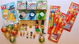 The Simpsons memorabilia: Burger King Simpsons watches, Simpsons Pez dispensers, Mini Simpsons bobblehead figures