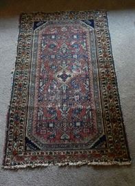 4 FOOT ANTIQUE EUROPEAN HAND MADE RUG IN VIVED SHADES OF REDS, BLUES, BLACKS, GREENS & BLUES