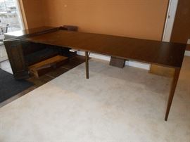Solid pecan table.  When open setting is 8'8" by 38" width.  With cabinet the table is 10' long.