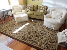 8' X 10' brown edged area rug  with accent colors of sage, federal blue, cream - excellent condition 