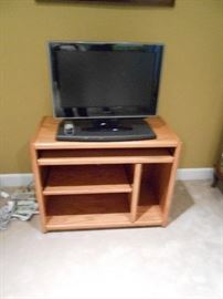 Toshiba TV about 8 years old - works.  Very nice wood cabinet with pull out panel for remotes etc.