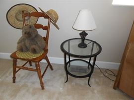 Wood chair, hats, metal/glass table