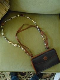 Dooney Bourke wallet purse with a bead shoulder handle and a leather handle