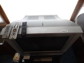 Samsung TV on stand- DVD/VHS player- DVDs/ VHS tap ...