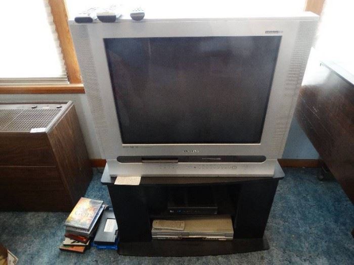 Samsung TV on stand- DVD/VHS player- DVDs/ VHS tap ...