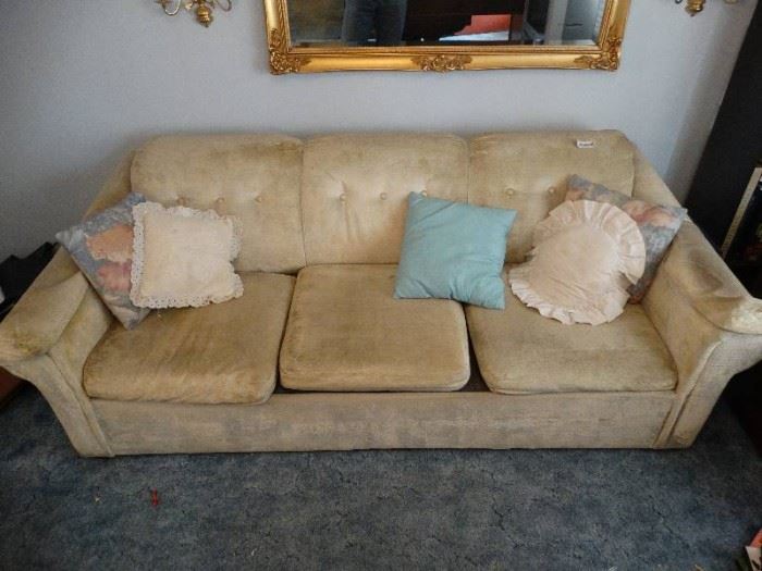 Tan 3 cushion hide-a-bed sofa w/ pillows