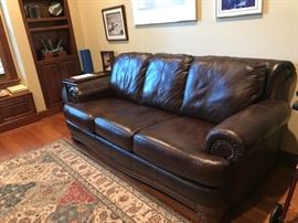 OUTSTANDING Leather sofa - note wood detail on skirt